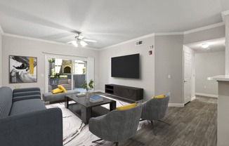 a living room with couches and a table and a television