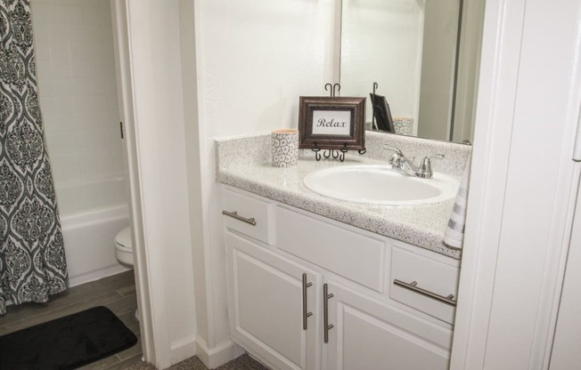 This is a photo of the bathroom  in the 653 square foot 1 bedroom apartment at Harvard Square Apartments, in Dallas, TX.