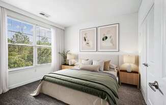 a bedroom with a bed and a large window at Aspire Apollo, Camp Springs, MD