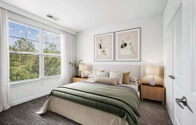 a bedroom with a bed and a large window at Aspire Apollo, Camp Springs, MD