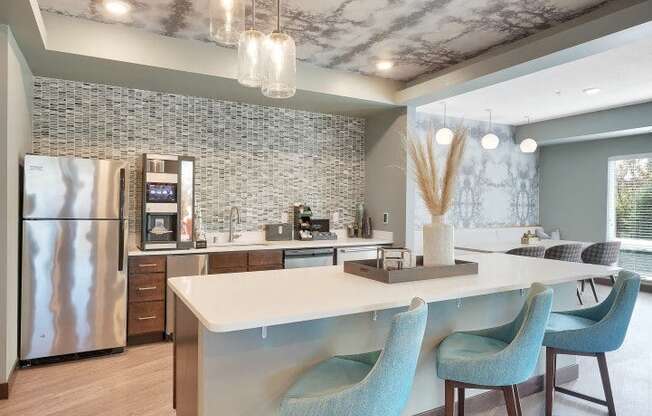 A modern kitchen with a marble ceiling and a central island.