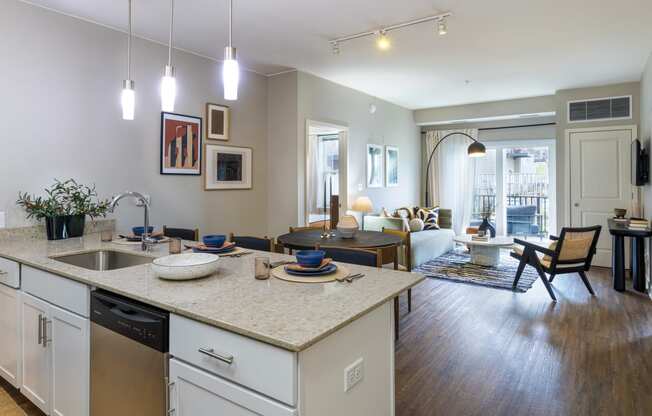 an open floor plan with a kitchen island and living room in the background