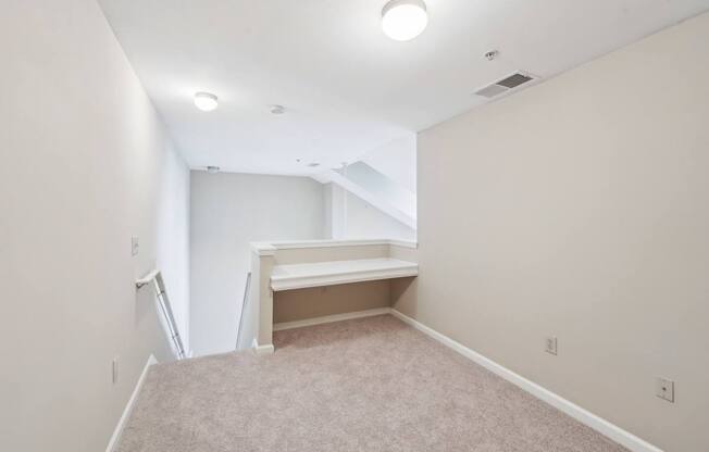 Up the stairs where a desk hutch is built in.