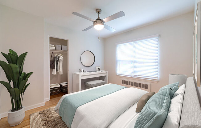 a bedroom with a bed and a ceiling fan