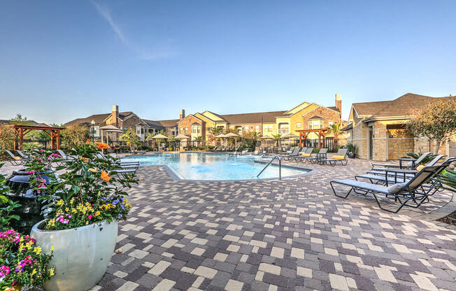 Daytime pool deck and exterior of apartments at Waterstone at Cinco Ranch, Texas, 77450