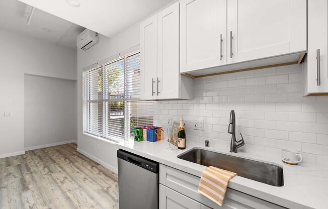 a kitchen with a stove and a sink