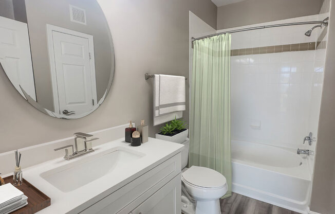 a bathroom with a sink toilet and a shower