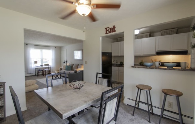 This is a photo of the dining room in the 740 square foot 1 bedroom model apartment at Compton Lake Apartments in Mt. Healthy, OH.