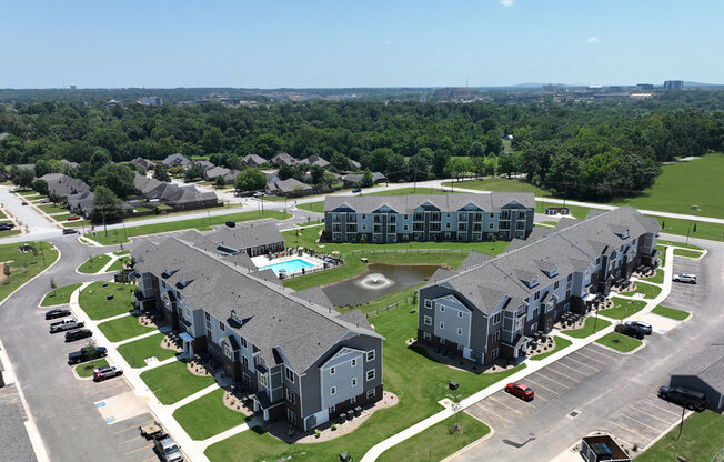 an aerial view of an apartment complex and parking lot at Dodson Pointe Apartment Homes, Rogers