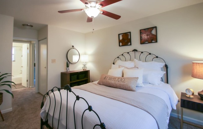 This is a photo of the bedroom of the 550 square foot 1 bedroom, 1 bath, balcony floor plan model apartment at College Woods Apartments in Cincinnati, OH.