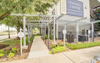 A leasing center with a sign that reads