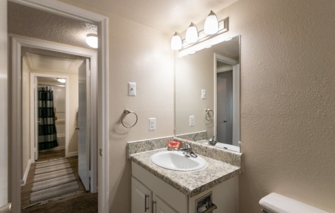 This is a photo of the bathroom in the 965 square foot 2 bedroom, 2 bath  apartment at Harvard Square Apartments, in Dallas, TX.