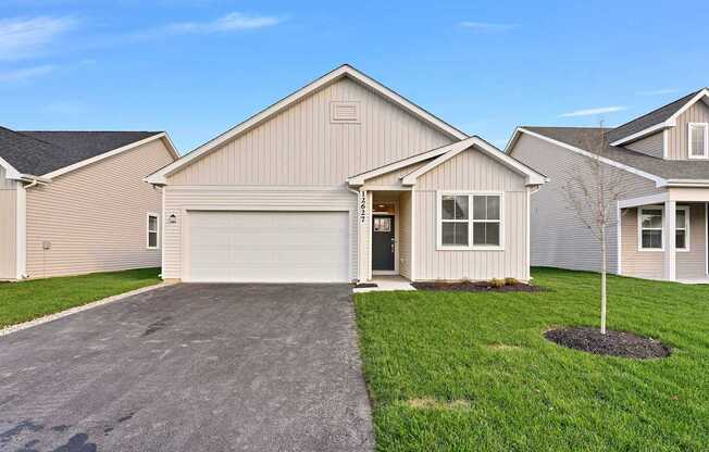 A house with a garage and a driveway.