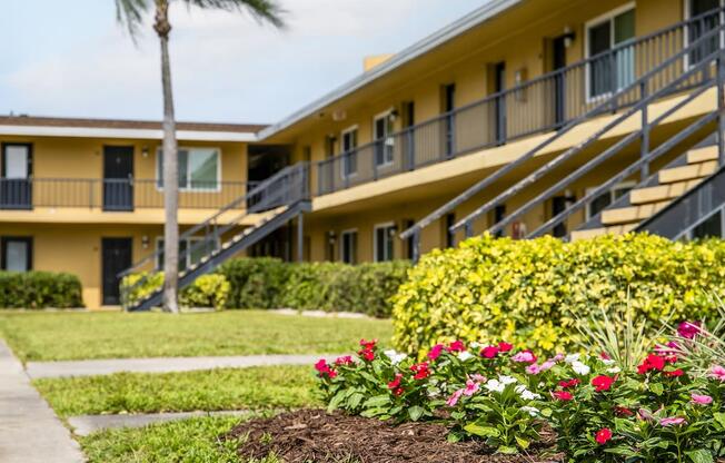 a picture of a building with flowers in front of it