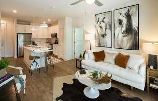 Open Floor Plans with Plenty of Living Space featuring Barn-Style Lighting and Reclaimed Wood-Inspired Flooring at Echo at North Pointe Center Apartment Homes, Alpharetta, GA 30009