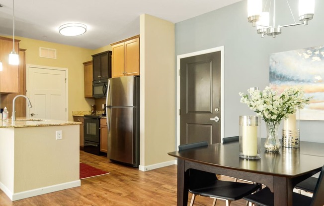 a kitchen and dining area in a 555 waverly unit