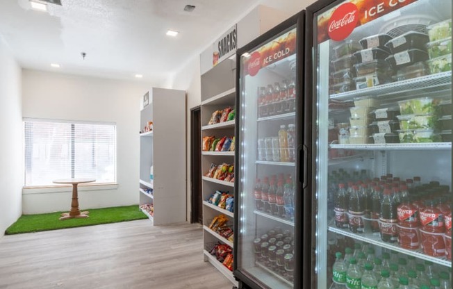 a room with a refrigerator and drinks in it