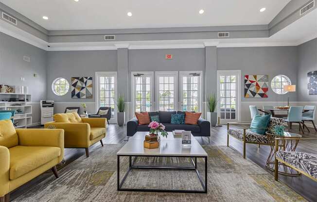 a living room with couches and chairs and a table