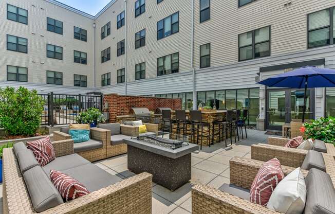 Patio with furniture and an umbrella at The View at Old City, Philadelphia