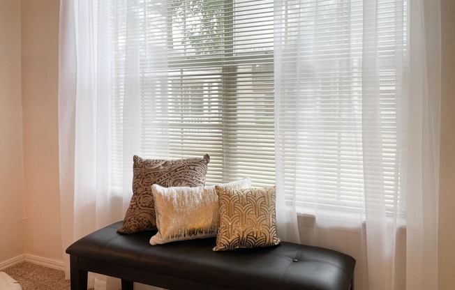 Bright windows overlooking lush landscaping at Greenbriar Apartments in Tulsa, OK!