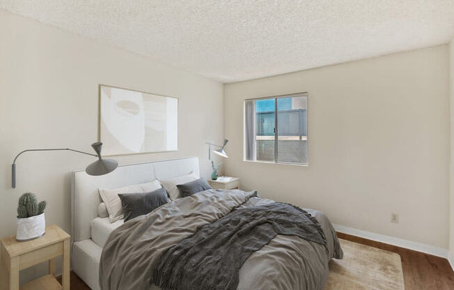 Model bedroom with wood-style vinyl flooring