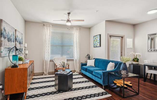 a living room with a blue couch