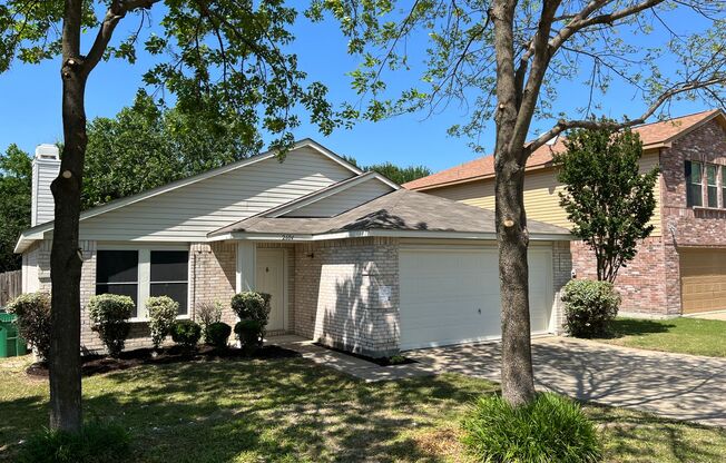 Happy home with a spacious floor plan that backs up to a greenbelt!