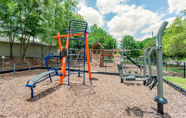 A playground with a swing set and a slide.