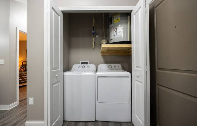 a laundry room with two washes and a dryer in it