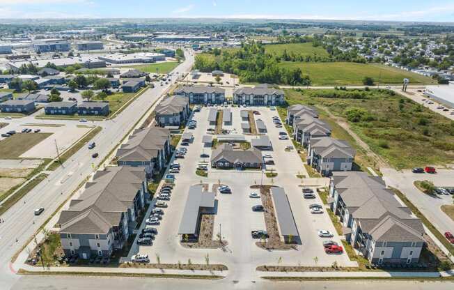 an aerial view of a row of houses with cars parked in front of them  at Union at Wiley, Iowa