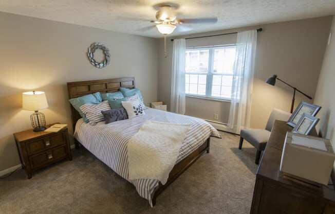 This is a photo of the bedroom in the 740 square foot 1 bedroom model apartment at Compton Lake Apartments in Mt. Healthy, OH.