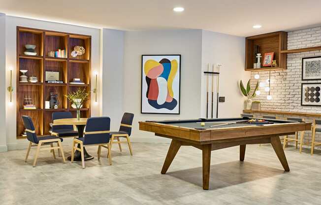 a living room with a pool table and a dining table at Dey & Bergen, Harrison, NJ