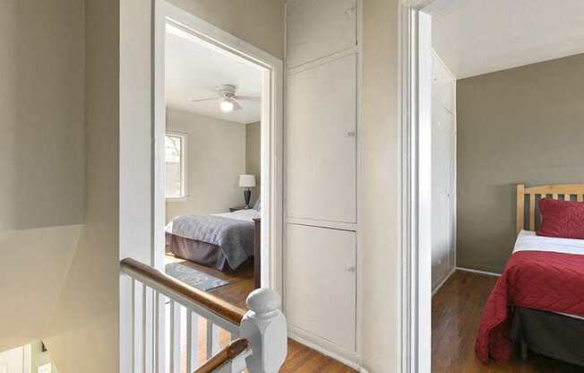 a bedroom with a bed and a mirrored closet