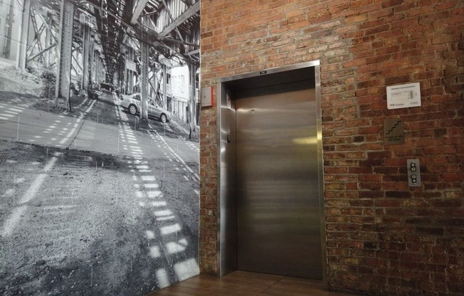 Fun mural on wall by the elevator at Carriage House Lofts, Chicago, 60605