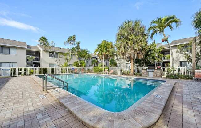 A small pool surrounded by a brick patio.
