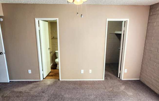 2x2 Downstairs Brown Upgrade Main Bedroom with Closet and Bathroom at Mission Palms Apartment Homes in Tucson AZ