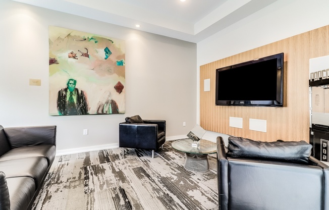A living room with a large painting on the wall and a flat screen TV, Plantation Crossing, Lafayette, LA, 70508