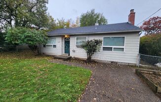 Super Cute Inner SE Home With Detached Garage, W/D Hook-ups and Fenced Yard!