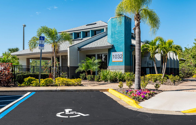 a parking lot with a wheelchair ramp in front of a building