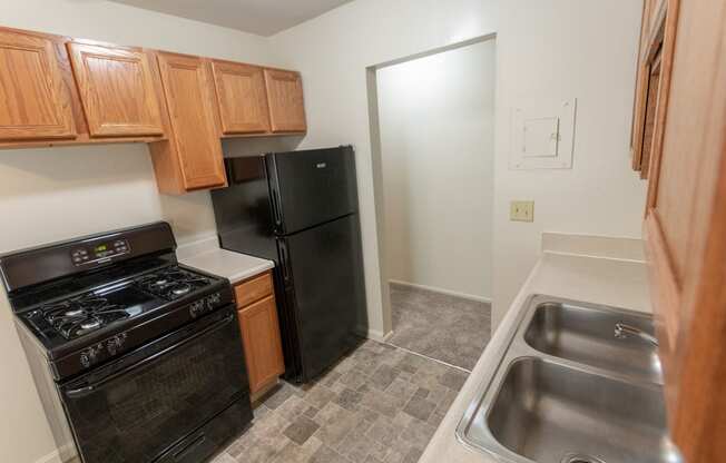 This is a photo of the kitchen in the 865 square foot, 2 bedroom, 1 and a half bath apartment at Blue Grass Manor Apartments in Erlanger, KY.