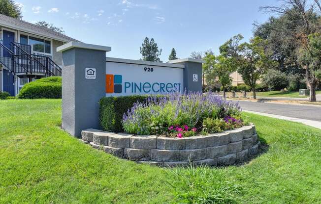 Pinecrest Monument Sign, Flower Bed, Grass and Apartment Exteriors at Pinecrest Apartments, California