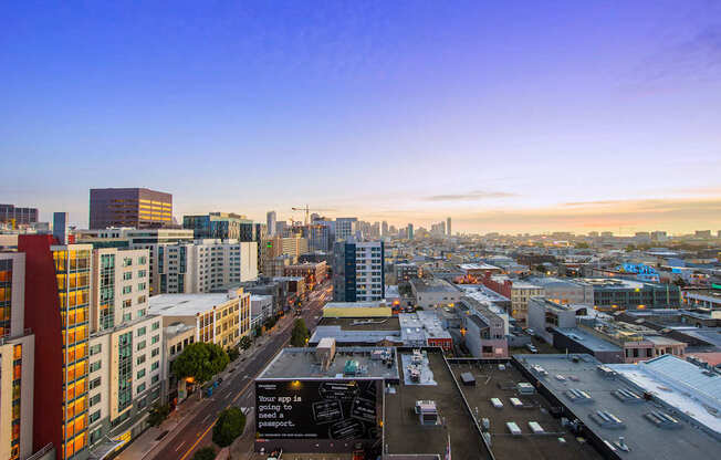 A cityscape with buildings and a clear sky.