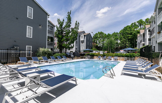 Sparkling Lap Pool with lounges at Sloan Square, Atlanta, GA, 30329.