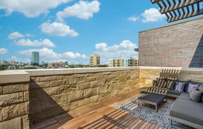 a roof deck with a view of the city