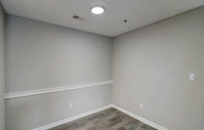 the interior of a room with white walls and wood floors at The Sapphire, Decatur, GA, 30035