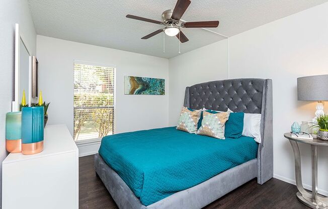 a bedroom with a bed and a ceiling fan at Sunset Canyon, San Antonio, 78232