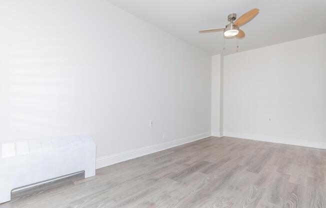 Vacant bedroom with wooden floors