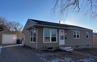 Charming Pet-Friendly Home with Fenced Yard and Detached Garage in East Sioux Falls