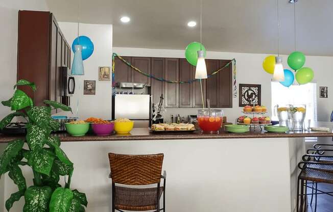 A kitchen with a bar area and a chair.