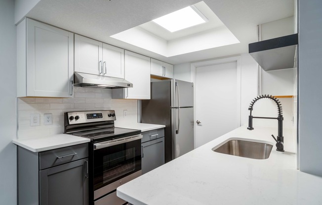 Kitchen with grey cabinets